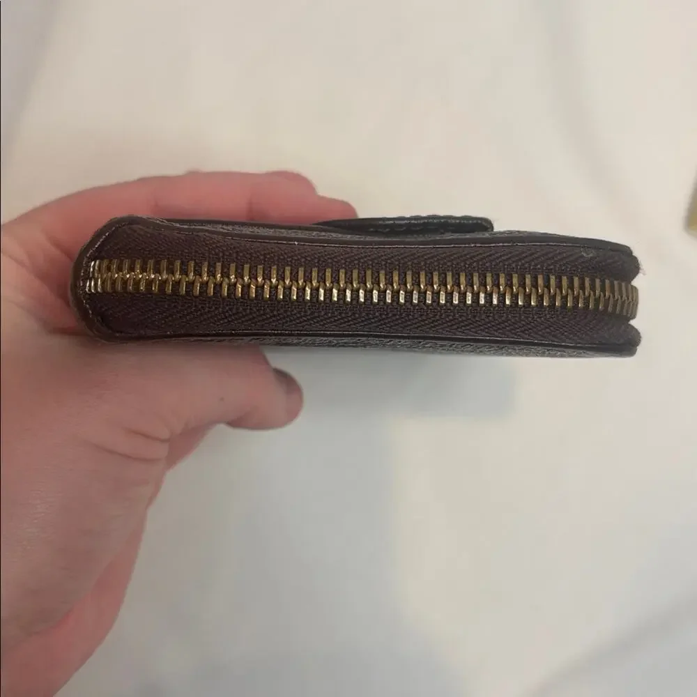 Chloe Lilly bow front long wallet in a metallic maroon brown